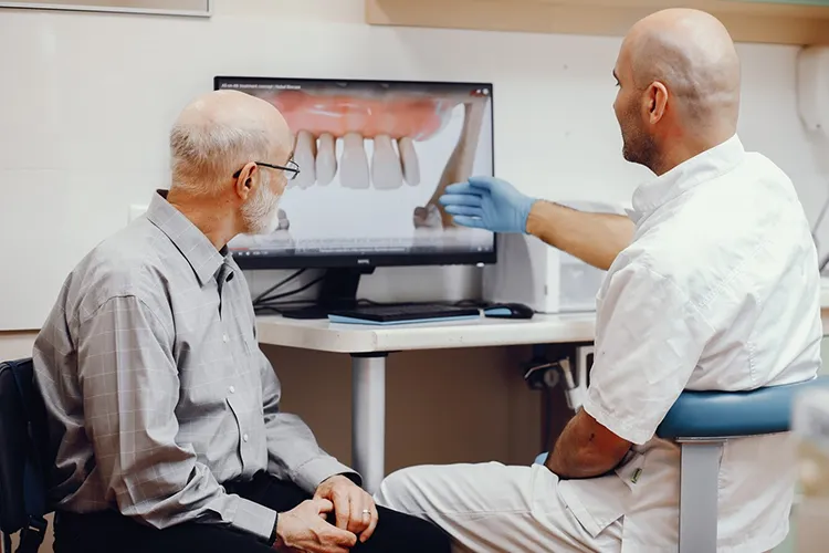 Pros and Cons of Dental Implants vs. Dentures