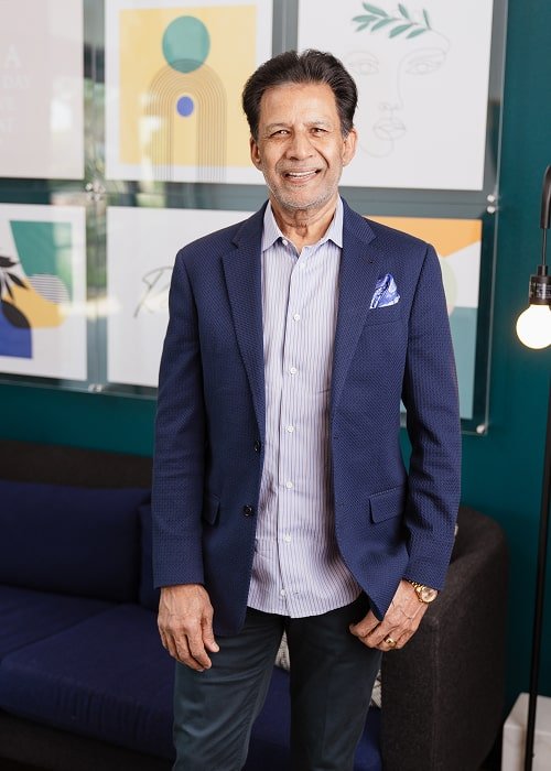 A man is lightly smiling