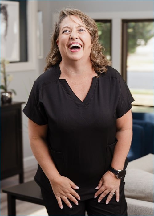 A woman is happily laughing