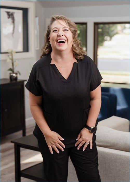 A woman is happily smiling