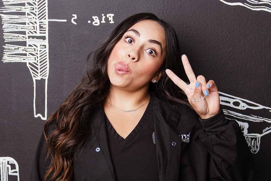 A woman is smiling and making faces