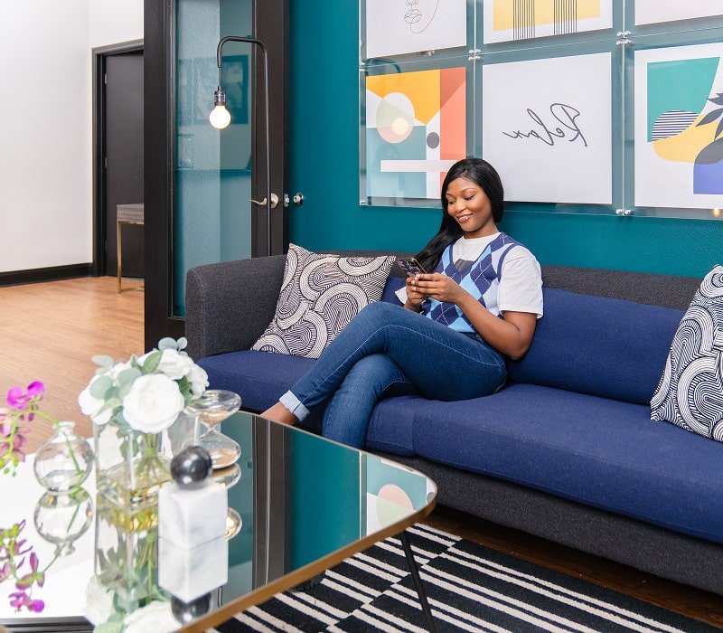 A woman is smiling in a brush365 dentistry