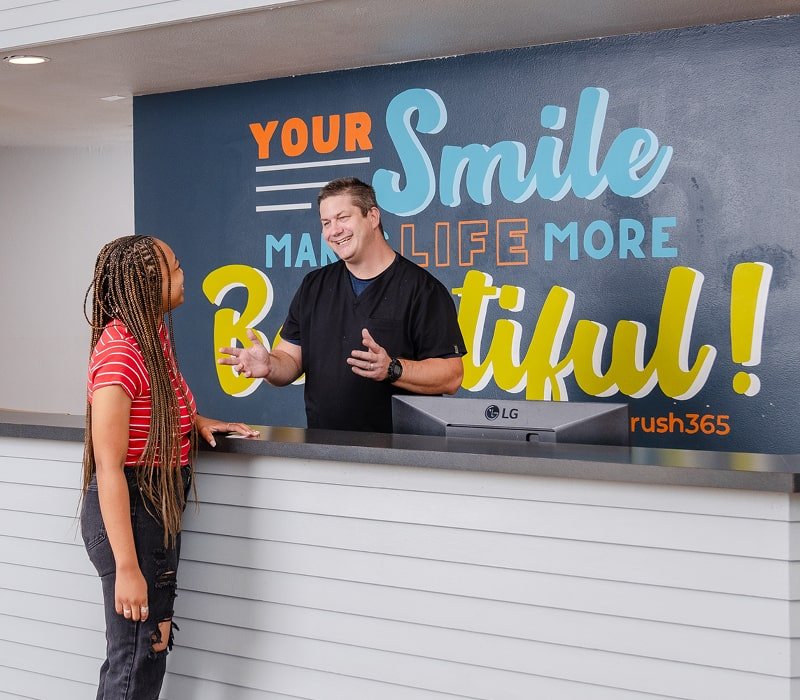 brush365 front desk personal is smiling and welcoming smiling patient