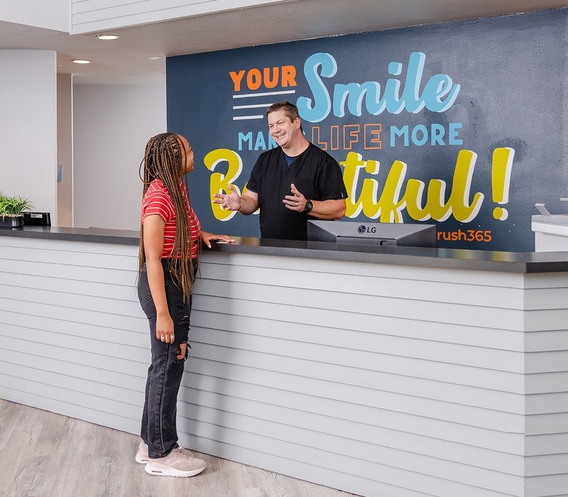 brush365 receptionist is welcoming happy clint and smiling