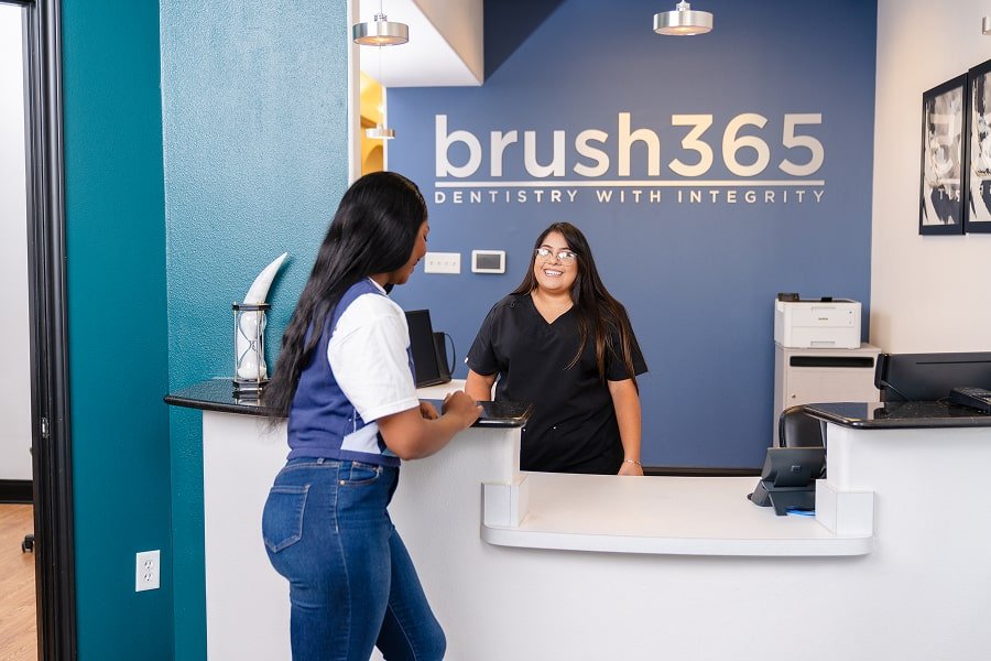 brush365 waiting room with patient and smiling receptionist