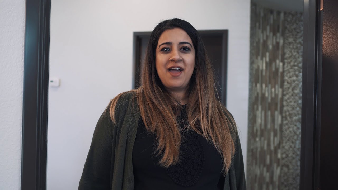 Dr. Mahmood is happily smiling at the brush365 office