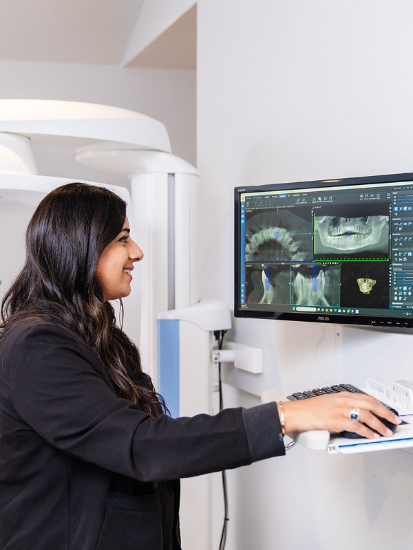 Dr. Mahmood working with a computer