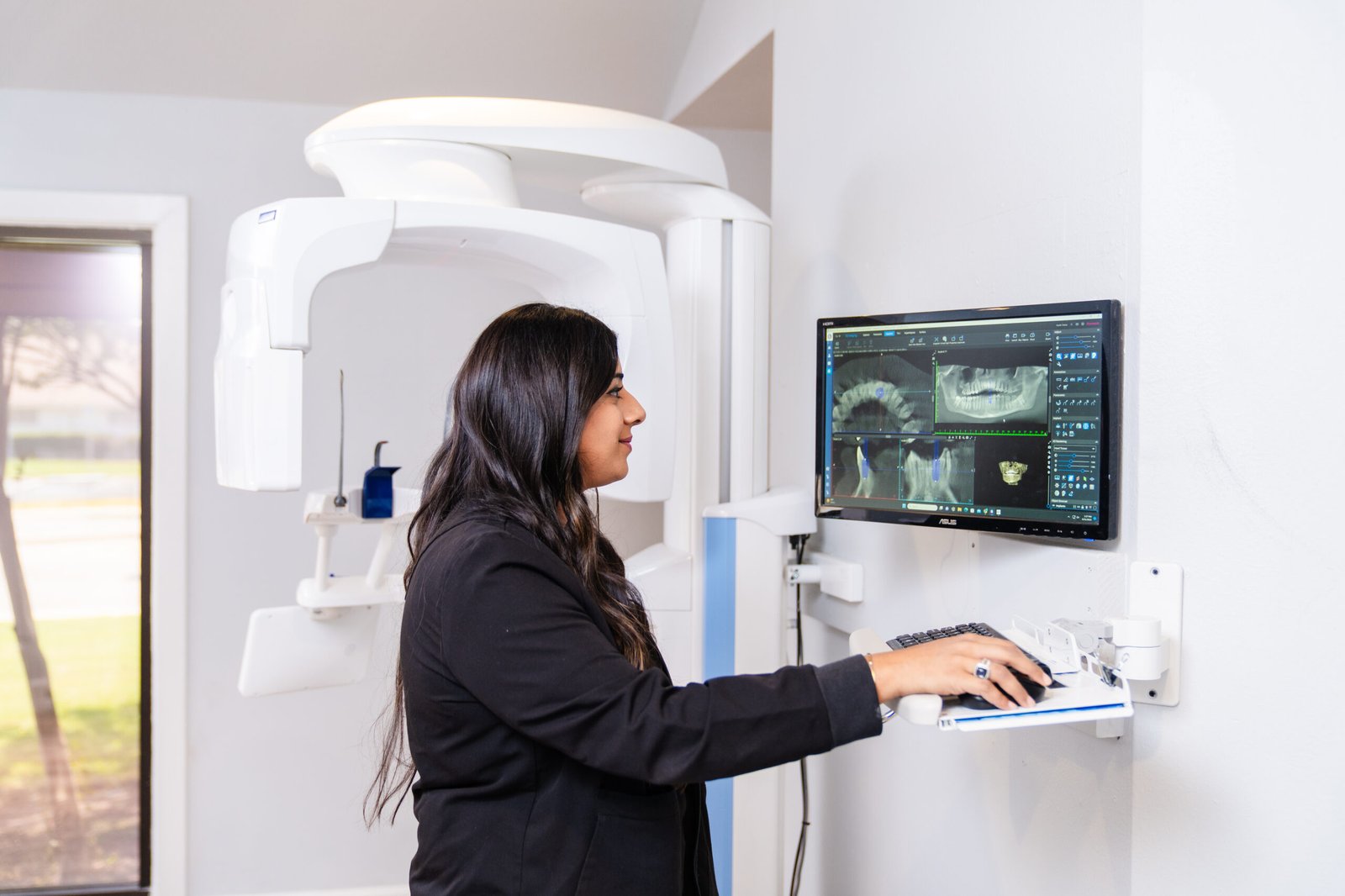 A woman is smiling in a brush365 dentistry